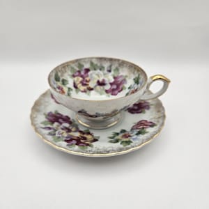 Teacup and Saucer Decorated with Pansies and Gold Trim