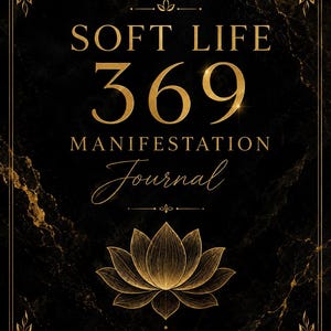 May include: A black journal with gold lettering and accents. The cover features the words "SOFT LIFE 369 MANIFESTATION Journal" and a lotus flower illustration. The text "WRITE IT. BELIEVE IT. RECEIVE IT." is at the bottom.