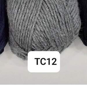 May include: Three balls of yarn in different colours: navy blue, grey, and black. The yarn balls are labelled with the codes TC15, TC12, and TC13.