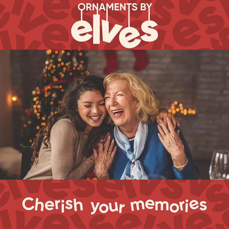 May include: Two people, an older woman and a younger woman, are laughing together in front of a decorated Christmas tree. The text "Cherish your memories" is at the bottom of the image. The background is red with the words "ornaments by elves" at the top.
