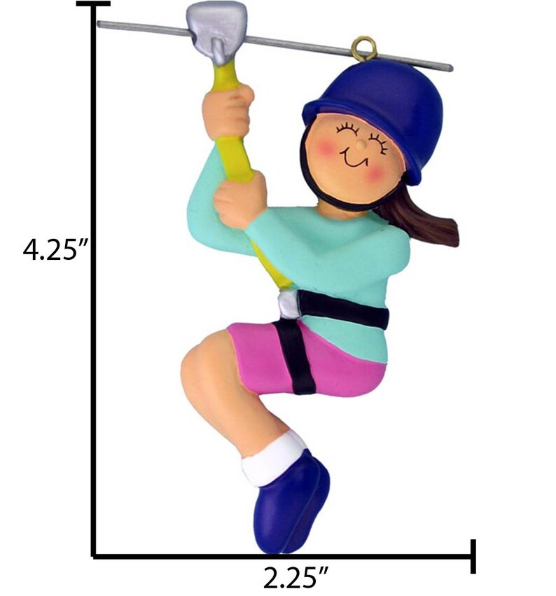 Peut inclure: Une d&eacute;coration de No&euml;l en forme de personne en train de faire de la tyrolienne, de couleur bleue et rose. La d&eacute;coration mesure 4,25 pouces de haut et 2,25 pouces de large.