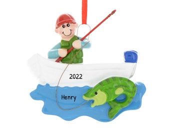 May include: A personalized Christmas ornament featuring a cartoon man in a boat fishing. The man is wearing a green life vest and a red hat. The boat is white with a blue motor. A green fish is jumping out of the water. The ornament says "Henry" and "2022".
