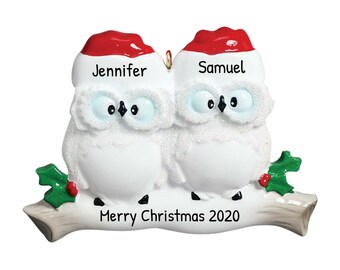 May include: White owl Christmas ornament with red Santa hats, the names Jennifer and Samuel, and the text "Merry Christmas 2020".