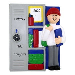 May include: A gray locker with the name "Matthew" and the text "NYU Congrats" on it. The locker has a combination lock and a shelf with books and school supplies. A student with a red hat and a backpack is standing next to the locker. The year "2020" is written on a white board on the locker.