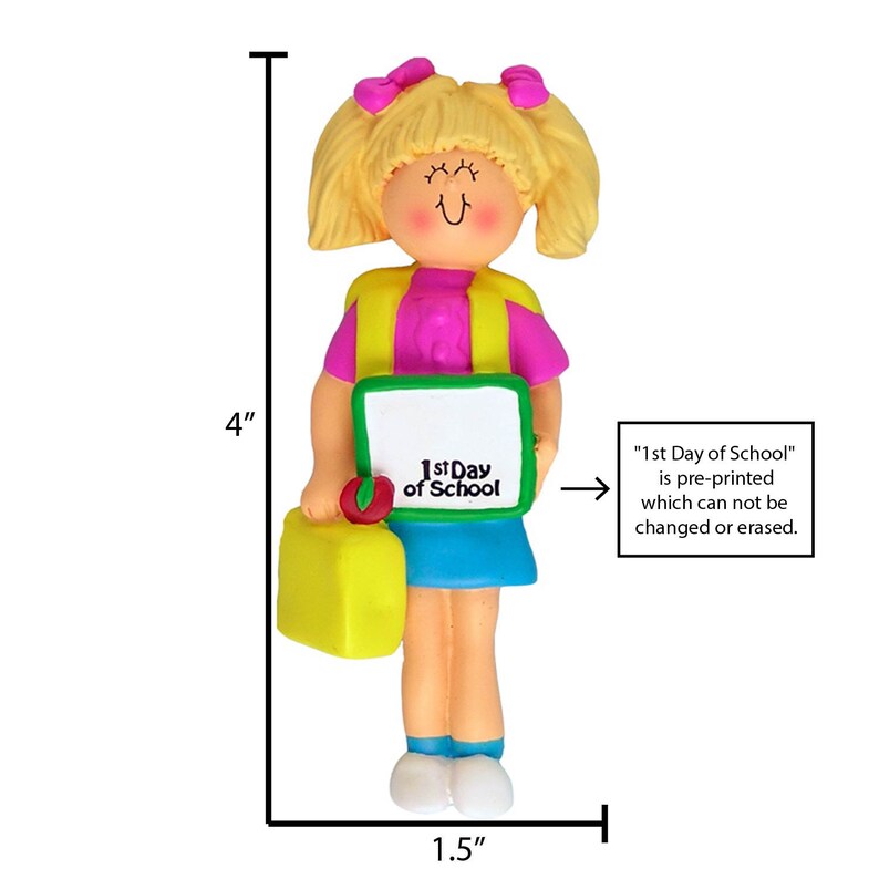 May include: A 4-inch tall girl figurine ornament with blonde hair, wearing a pink shirt, yellow vest, blue skirt, and white shoes. She is holding a green book that says "1st Day of School" and a yellow lunchbox. The text "1st Day of School" is pre-printed and cannot be changed or erased.