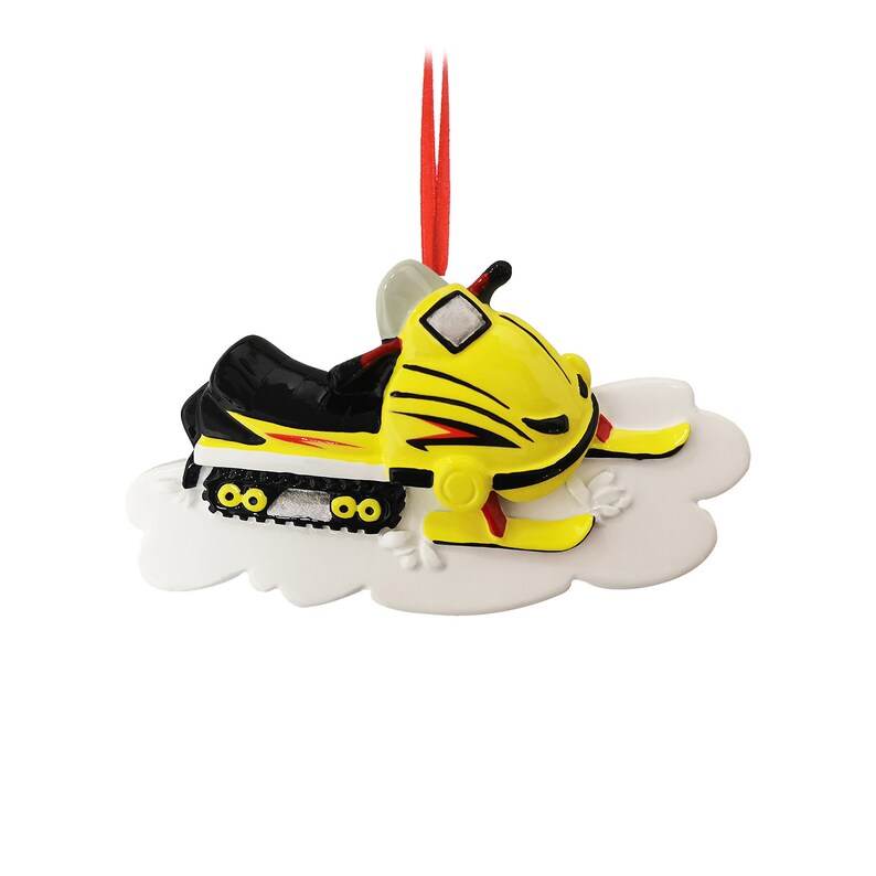 May include: Yellow and black snowmobile Christmas ornament with a white cloud base.