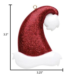 May include: Red glitter Santa hat ornament with white fur trim, 3.5 inches tall and 3.25 inches wide.