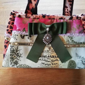 Designer handbag, unique Bow-Brooch Bag