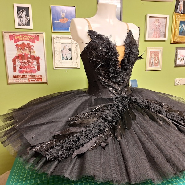 Professional ballet tutu Black Swan, richly decorated with various trims, feathers and Swarovski elements. Swan Lake