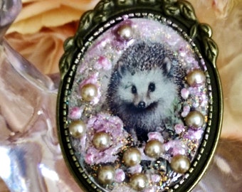 Hedgehog necklace brings good luck to the countryside, hedgehog hidden among the roses in the garden