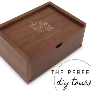 May include: A wooden box with a drawer, engraved with the quote "Oh! The places you'll go!" and the text "Congratulations Class of 2024".