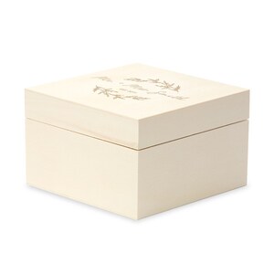 May include: A white wooden box with a gold inscription that reads "Mr. & Mrs. Smith Established 2023" with a floral wreath design.