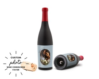 May include: A black wine bottle-shaped corkscrew with a red top and a light blue label featuring a photo of a couple. A cork and a second corkscrew are also visible. The text "THANK YOU" is on the label.