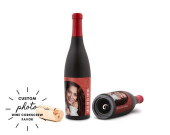 May include: Black wine bottle-shaped corkscrew with a red top. The bottle has a custom photo label and the text "Cheers to 40 Years". A cork is next to the bottle. The words "Custom Photo Wine Corkscrew Favor" are also in the image.