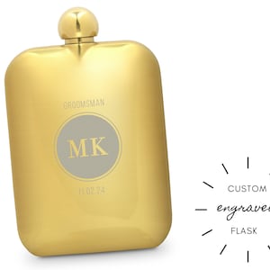 May include: Gold metal flask with a brushed finish. The flask is engraved with the text "Groomsman", "MK", and "11.02.24".
