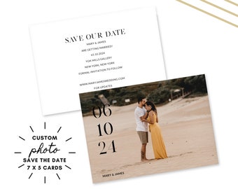 May include: Save the date card with a black and white photo of a couple kissing on a beach. The date is June 10, 2024. The card also includes the names Mary & James.