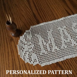 May include: A cream-coloured, crocheted table runner with an openwork design. A small, wooden toothpick holder with toothpicks is to the left of the runner. The text "PERSONALIZED PATTERN" is at the bottom of the image.
