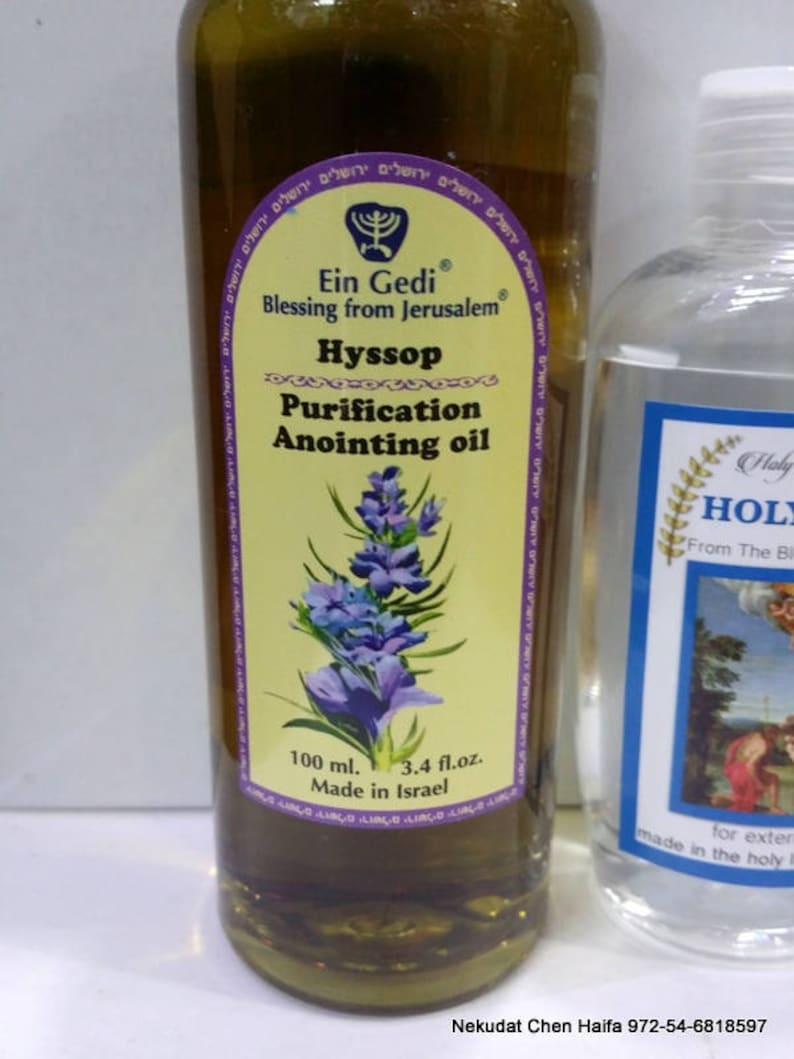 May include: A glass bottle of Ein Gedi Hyssop Purification Anointing Oil, a yellow label with a menorah and the text "Blessing from Jerusalem" in Hebrew and English. The bottle contains 100 ml or 3.4 fl. oz. of oil and is made in Israel.