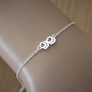 Minimalist bracelet in sterling silver with small cat or dog paws