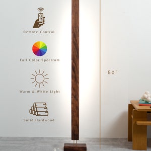 May include: A modern, dark wood floor lamp with a rectangular design. The lamp is 60 inches tall and 9 inches wide at the base. Features include remote control, full color spectrum, warm and white light, and solid hardwood construction.