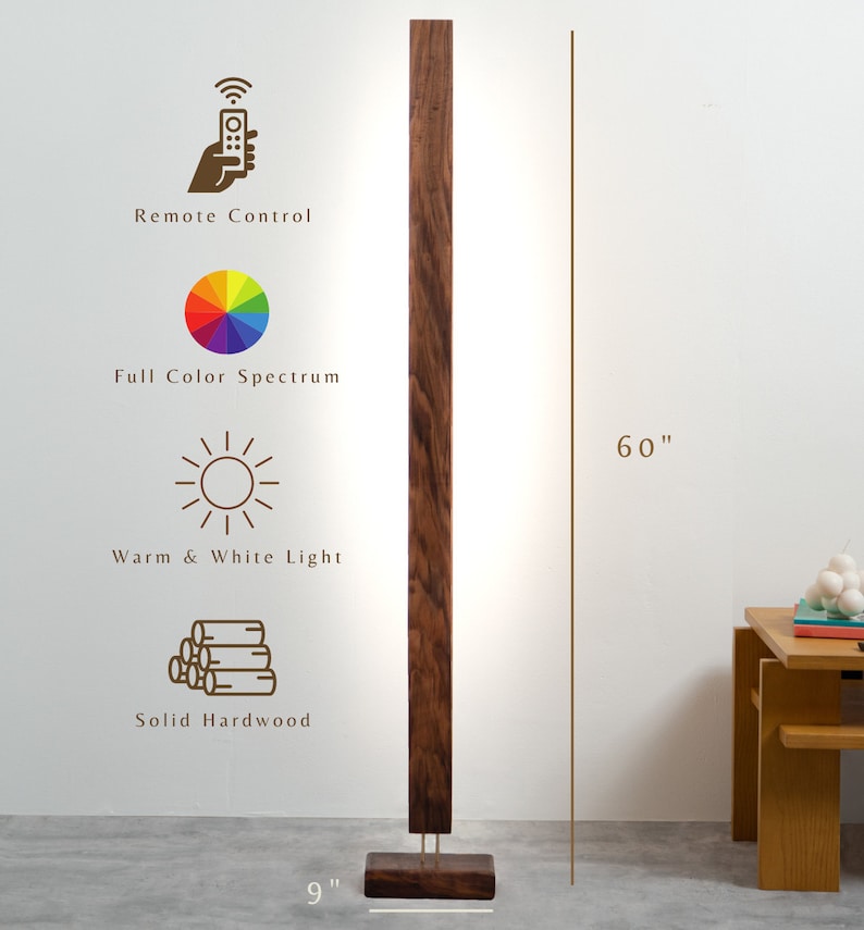 May include: A modern, dark wood floor lamp with a rectangular design. The lamp is 60 inches tall and 9 inches wide at the base. Features include remote control, full color spectrum, warm and white light, and solid hardwood construction.