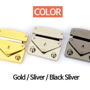 May include: Three metal purse clasps in gold, silver, and black. Each clasp has a rectangular base with rounded corners, a hinged top, and decorative rivets. The word "COLOR" is in a red rectangle above the clasps. The text "Gold / Sliver / Black Sliver" is below.