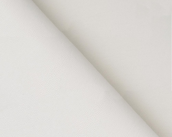 May include: A close-up of a folded piece of white leather. The leather has a textured surface with a subtle, pebbled grain. The folds create diagonal lines across the image, highlighting the material's flexibility and drape.