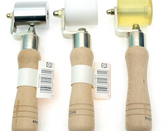 May include: Three hand rollers with wooden handles. The rollers are silver, white, and yellow. Each roller has a metal frame and a wooden handle. The handles are light brown. Each roller has a tag with Japanese text.