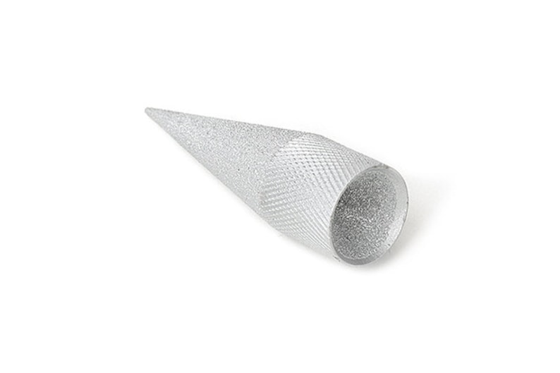 May include: A silver-colored, cone-shaped tool with a textured, diamond-patterned grip. The tool tapers to a point and has a cylindrical base. The object is set against a white background.