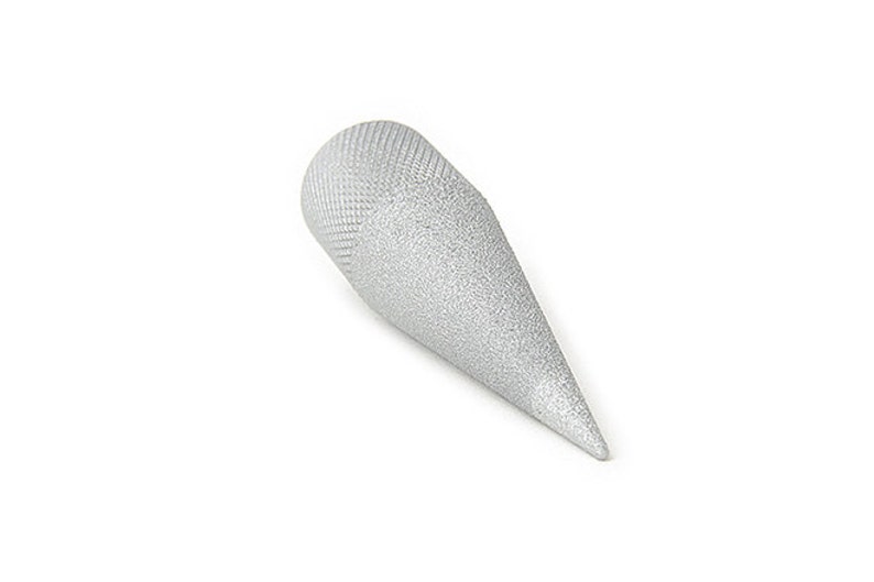 May include: A silver-colored, cone-shaped object with a textured, rounded top and a pointed end. The object is set against a white background, highlighting its shape and metallic appearance. The design suggests a tool or decorative item.
