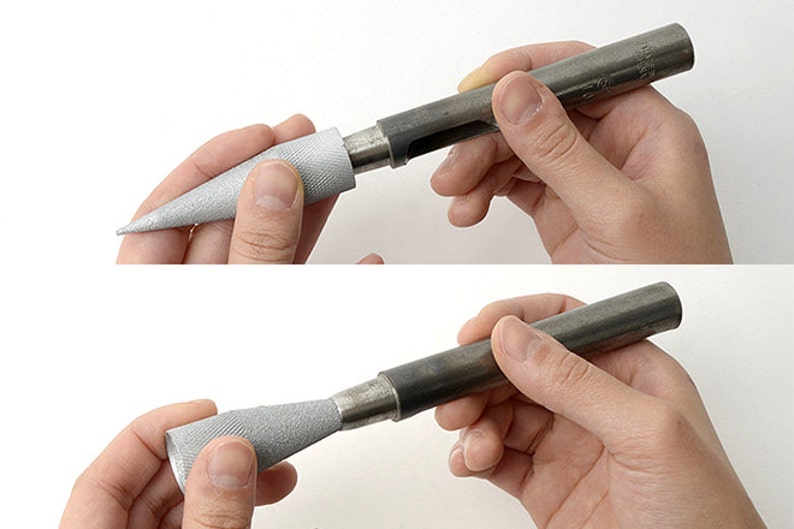 May include: A metal tool with a textured silver handle and a pointed tip. The tool is shown in two configurations, with the handle and tip either connected or separated. The tool appears to be used for shaping or smoothing materials.