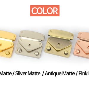 May include: Four metal purse clasps in gold, silver, antique, and pink matte finishes. Each clasp has a rectangular top, a triangular flap, and two round rivets. The word "COLOR" is in a red box above the clasps.