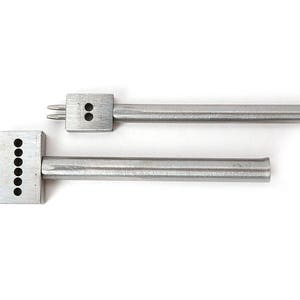 May include: Two silver leatherworking tools. One has two prongs and two holes, the other has six prongs and six holes. Both tools have a rectangular head and a long, cylindrical handle. They are designed for creating evenly spaced holes in leather.