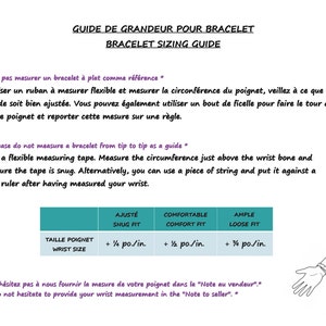 May include: Guide for measuring bracelet size in inches.  Instructions in French and English.  A diagram shows how to measure your wrist.