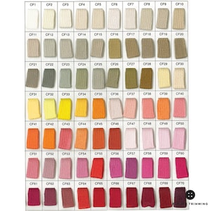 Puede incluir: Una carta de colores de 70 muestras de tela, cada una etiquetada con un código, como CF1, CF2, CF3, etc. Las muestras están dispuestas en filas y columnas, y los colores van del blanco al rojo.