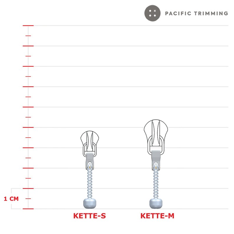May include: Two silver zipper pulls with a metal slider and a chain. The zipper pull on the left is labeled "KETTE-S" and the zipper pull on the right is labeled "KETTE-M". A ruler with 1 cm markings is shown on the left side of the image.