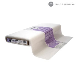 May include: A roll of white Heat-Bond fusible interfacing for crafts and sewing projects. The interfacing is packaged in a cardboard box with the brand name and product information printed on it. The interfacing is a lightweight, non-woven fabric that is used to stabilize and add structure to fabrics.