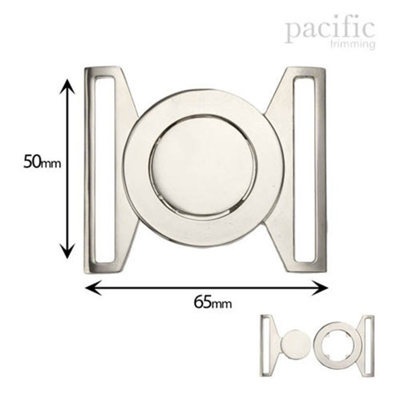 May include: Silver metal buckle with a round center, measuring 6.5 cm wide and 5 cm tall. pacific trimming is printed on the image.