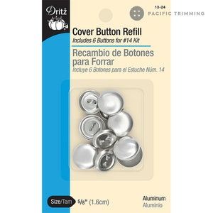 May include: A package of six 5/8 inch aluminum cover buttons for sewing. The buttons are silver and come in a clear plastic package with a white label that says "Dritz Cover Button Refill Includes 6 Buttons for #14 Kit Recambio de Botones para Forrar Incluye 6 Botones para el Estuche Núm. 14 Size/Tam 5/8" (1.6cm) Aluminum Aluminio".