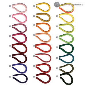 May include: A chart of 12 different colored cords, each with a number next to it. The cords are arranged in three columns of four cords each. The cords are all the same size and shape, and they are all made of the same material. The cords are all different colors, including red, blue, green, yellow, orange, and purple.