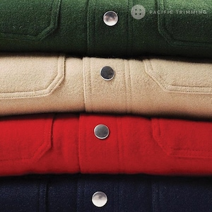 May include: Four different colored fabric jackets stacked on top of each other. The jackets are green, beige, red, and navy blue. Each jacket has a single button on the front.