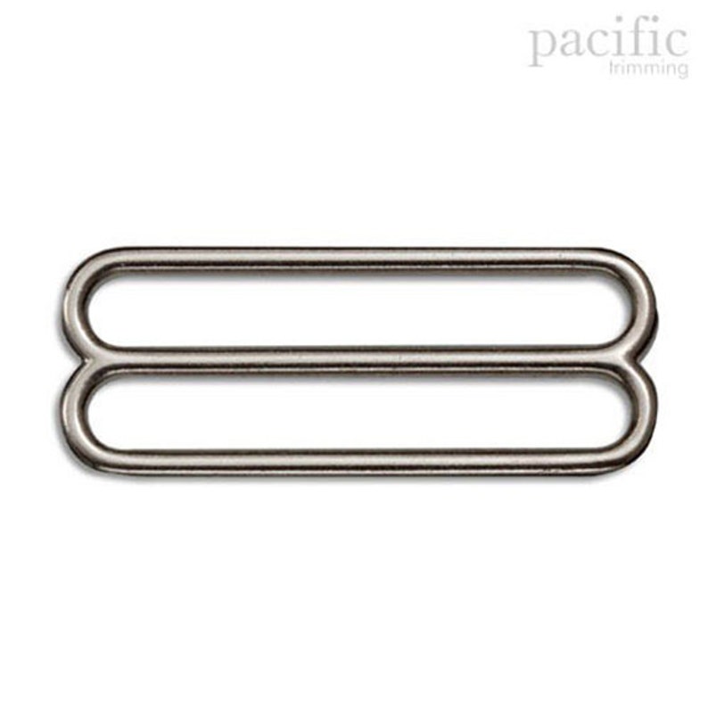 May include: Silver metal slider buckle with two loops.