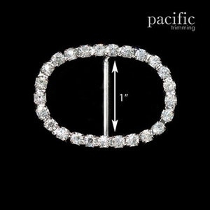 May include: Silver oval-shaped buckle with a row of clear rhinestones around the perimeter. The buckle measures 1 inch in diameter.