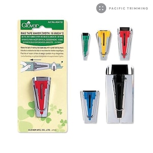 May include: Clover Bias Tape Maker, a tool for making bias tape, with a width of 3/4 inch (18 mm). The package shows the tool in red, blue, yellow, and green. The package also includes instructions on how to use the tool.