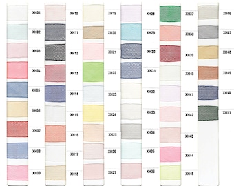 May include: A color chart of Pacific Trimming ribbons, featuring a variety of colors and textures. Each ribbon sample is labeled with a unique code, such as XH01, XH02, and XH03. The chart displays a wide range of hues, from pastels to vibrant shades.
