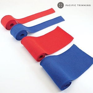 May include: Four rolls of elastic knit fabric in red and blue. The fabric is ribbed and has a soft texture. The rolls are arranged in a staggered pattern on a white background. The text "PACIFIC TRIMMING" is visible in the top right corner of the image.
