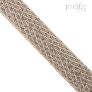 May include: A beige woven trim with a chevron pattern. The trim is approximately 1 inch wide.