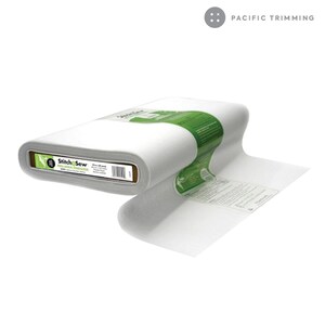 May include: A roll of white Stitch & Sew interfacing fabric. The label reads "Stitch & Sew Interfacing" and is green and white.