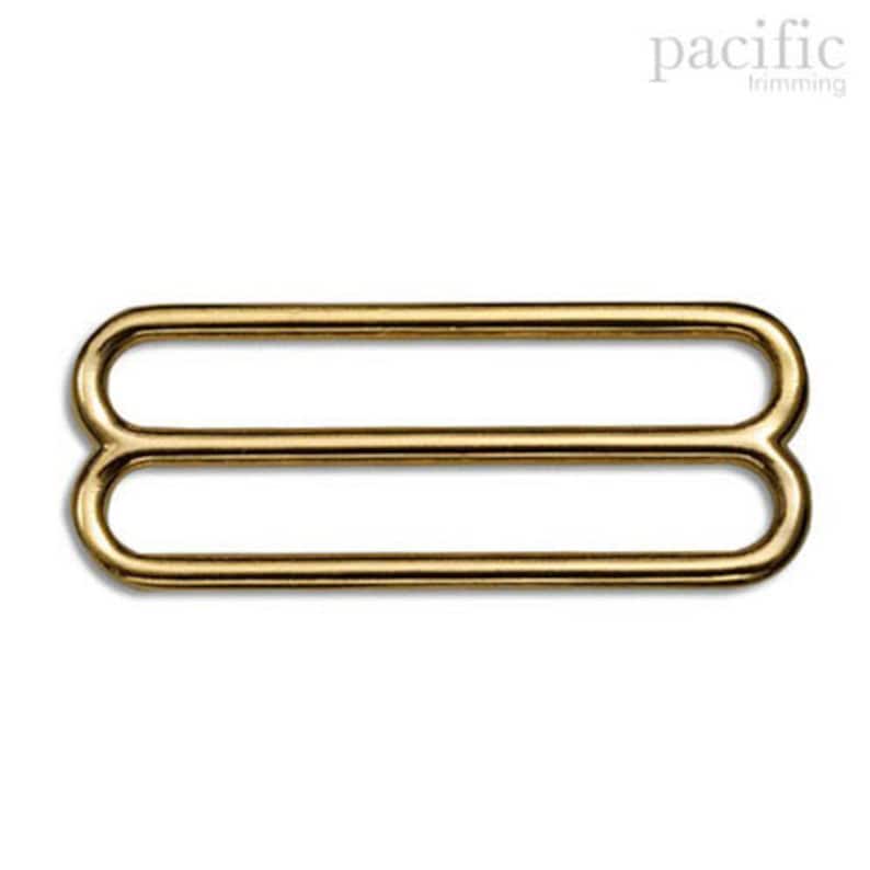 May include: Gold metal slider buckle with two loops.