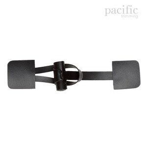 May include: Black leather toggle closure with two rectangular tabs. The toggle is made of a braided leather strap with a knotted design.